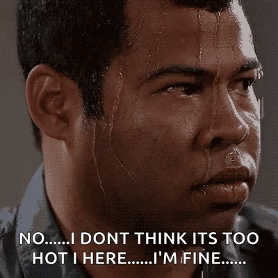 A Man Is Sweating And Says No I Dont Think Its Too Hot I Here I 'M Fine . GIF