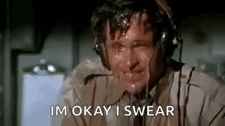 A Man Is Sweating While Wearing Headphones And Says `` Im Okay I Swear '' . GIF