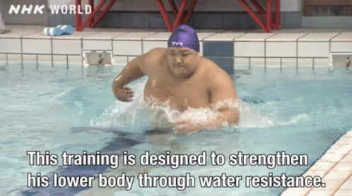 A Man Is Swimming In A Pool With Nhk World Written On The Bottom GIF