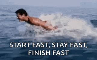 A Man Is Swimming In The Ocean With The Words `` Start Fast , Stay Fast , Finish Fast '' . GIF