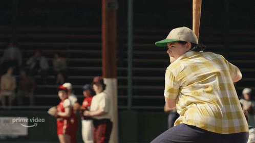 A Man Is Swinging A Baseball Bat In Front Of A Sign That Says " Prime Video " GIF