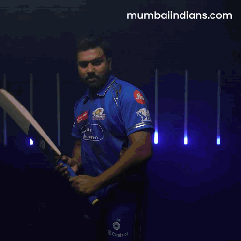 A Man Is Swinging A Bat With A Jio Logo On His Shirt GIF