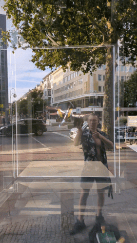 Man Taking Selfie In Front Of Building 'A GIF