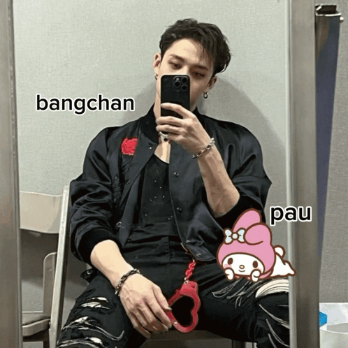 A Man Is Taking A Picture Of Himself In Front Of A Mirror With Bangchan And Pau Written On The Bottom GIF