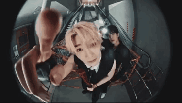 A Man Is Taking A Picture Of Himself With A Fisheye Lens While Another Man Looks On . GIF