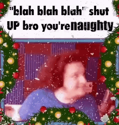 A Man Is Taking A Selfie In Front Of A Christmas Tree While Holding A Cell Phone . GIF