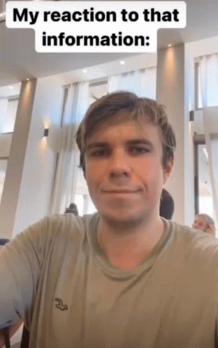 A Man Is Taking A Selfie With A Caption That Says " My Reaction To That Information " GIF