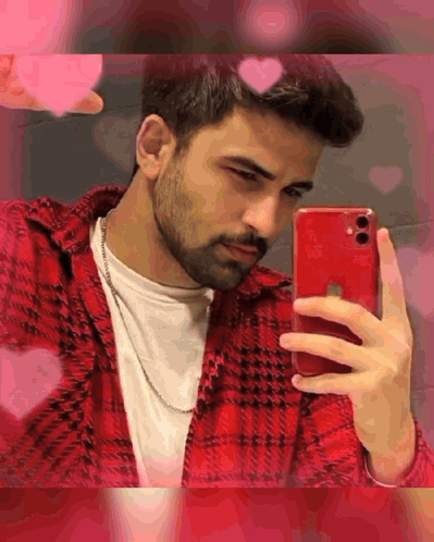 A Man Is Taking A Selfie With His Red Iphone . GIF