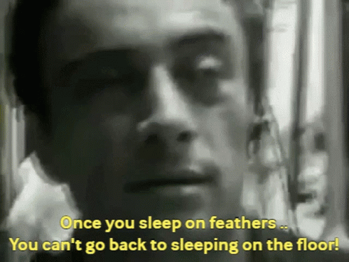 A Man Is Talking About Sleeping On The Floor GIF