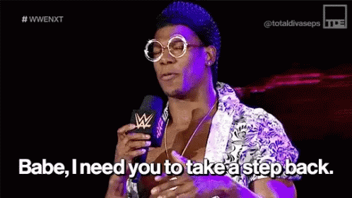 A Man Is Talking Into A Microphone And Saying Babe I Need You To Take A Step Back GIF