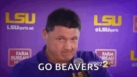 A Man Is Talking Into A Microphone And Says `` Go Beaver '' . GIF