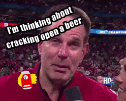 A Man Is Talking Into A Microphone And Says " I 'M Thinking About Cracking Open A Beer " .. GIF