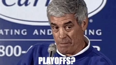 a man is talking into a microphone and the words playoffs are visible on his face .
