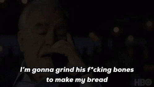 A Man Is Talking On A Cell Phone And Saying I 'M Gonna Grind His Fucking Bones To Make My Bread GIF