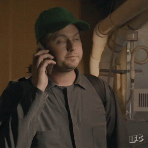 A Man Is Talking On A Cell Phone And Saying I 'M In GIF