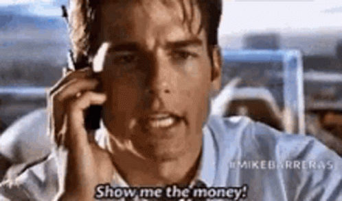 A Man Is Talking On A Cell Phone And Says `` Show Me The Money ! '' GIF