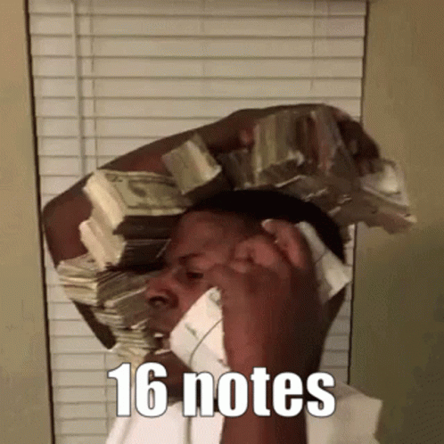 A Man Is Talking On A Cell Phone While Holding A Large Stack Of Money On His Head . GIF