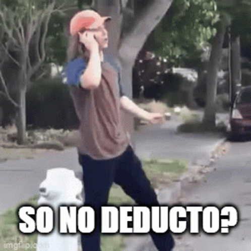 A Man Is Talking On A Cell Phone While Standing Next To A Fire Hydrant On The Side Of The Road . GIF