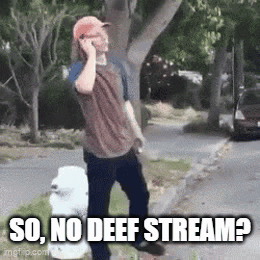 A Man Is Talking On A Cell Phone While Standing On The Side Of The Road . GIF
