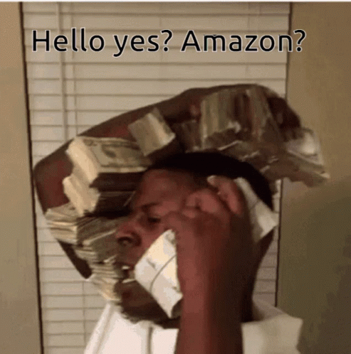 A Man Is Talking On A Cell Phone With A Stack Of Money On His Head GIF