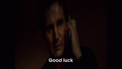 A Man Is Talking On A Cell Phone With The Words Good Luck Written Below Him GIF