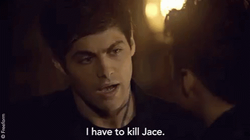 A Man Is Talking To A Woman In A Dark Room And Saying `` I Have To Kill Jace '' . GIF