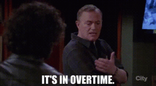 A Man Is Talking To Another Man And Saying `` It 'S In Overtime . '' GIF