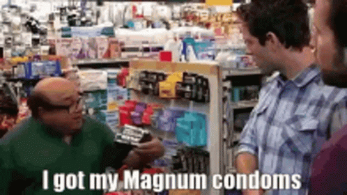 A Man Is Talking To Another Man In A Store About Condoms . GIF