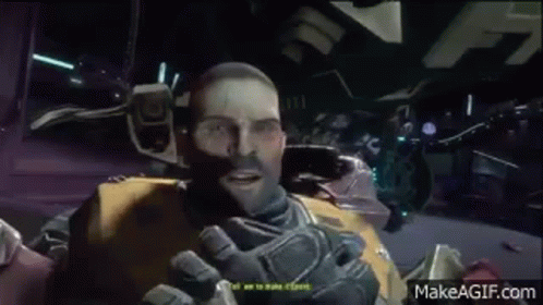A Man Is Talking To Another Man In A Video Game While Wearing A Helmet . GIF