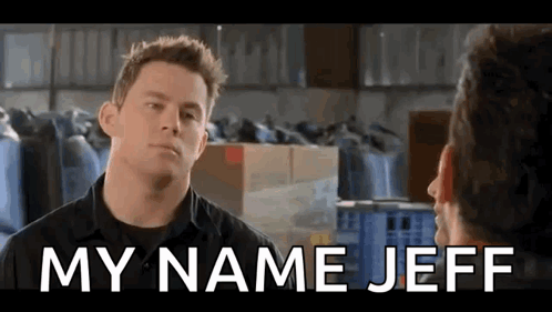 A Man Is Talking To Another Man In A Warehouse With The Words `` My Name Jeff '' Above Him . GIF