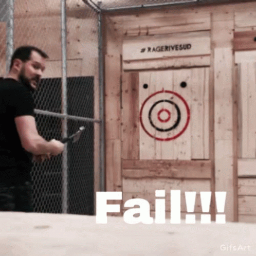 A Man Is Throwing An Axe In Front Of A Target That Says Fail GIF