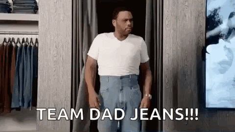 A Man Is Trying On A Pair Of Jeans In A Dressing Room And Says `` Team Dad Jeans '' . GIF