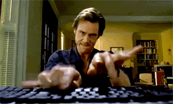 A Man Is Typing On A Keyboard While Making A Funny Face GIF