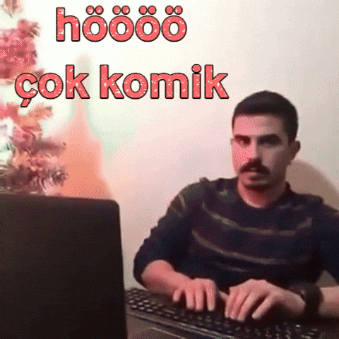 A Man Is Typing On A Keyboard With The Words Hoööö Çok Komik Written Above Him GIF