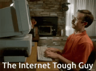 A Man Is Typing On A Keyboard With The Words The Internet Tough Guy Behind Him GIF