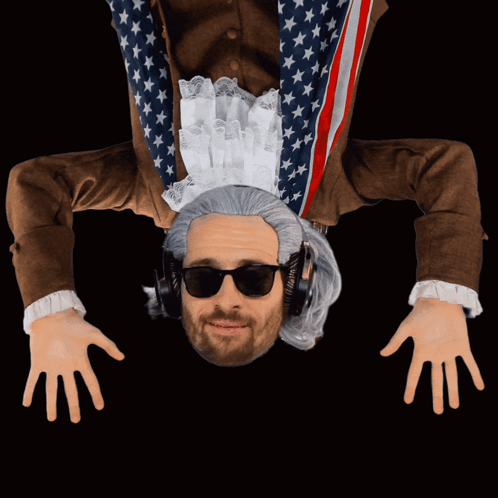 A Man Is Upside Down Wearing Headphones And A Wig GIF
