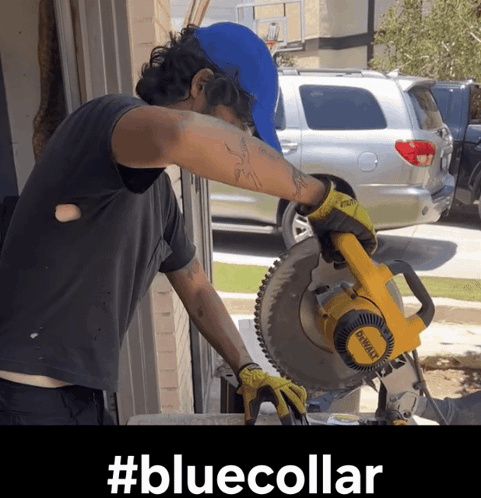 A Man Is Using A Dewalt Circular Saw GIF
