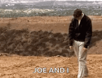 A Man Is Walking On A Beach With The Words Joe And I On The Bottom . GIF