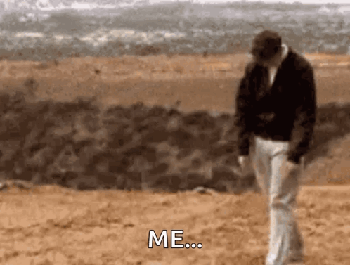 A Man Is Walking On A Dirt Road And Says Me GIF