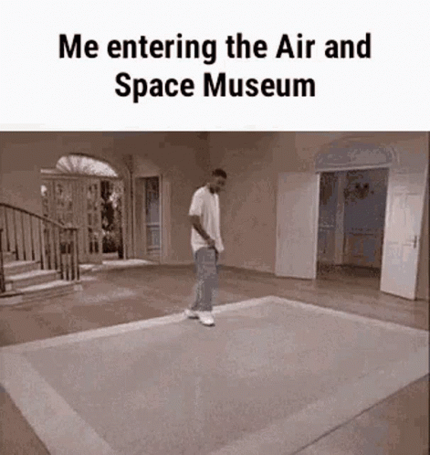 A Man Is Walking On A Rug In A Room With The Words `` Me Entering The Air And Space Museum '' Written On It . GIF