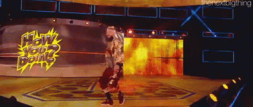 a man is walking on a stage with a sign that says how your doin '