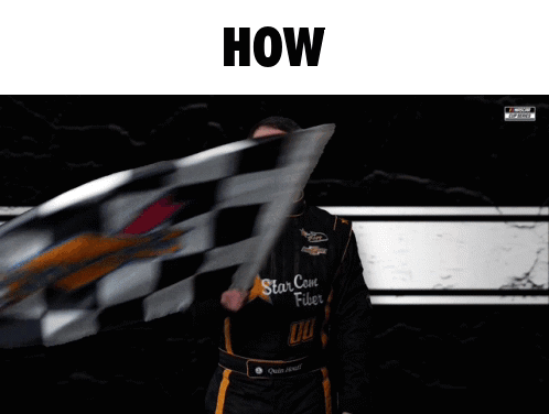 A Man Is Waving A Checkered Flag With The Words How Above Him GIF