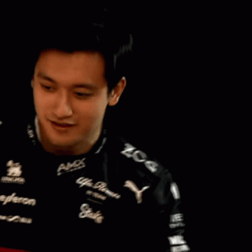 A Man Is Wearing A Black Shirt That Says Amx On It GIF