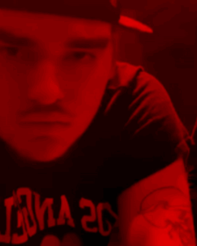 A Man Is Wearing A Black Shirt That Says Luna 20 On It GIF