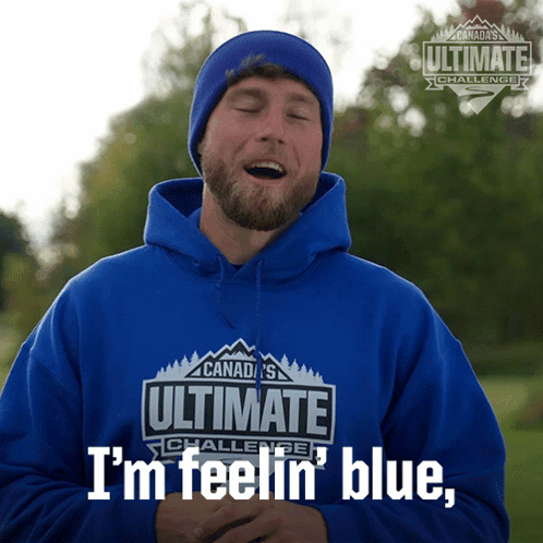 A Man Is Wearing A Blue Hoodie That Says Ultimate Challenge GIF