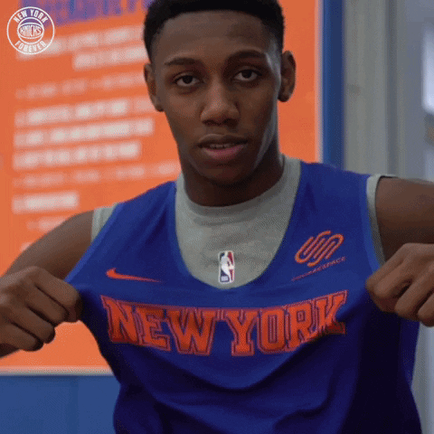 A Man Is Wearing A Blue Jersey That Says New York On It GIF