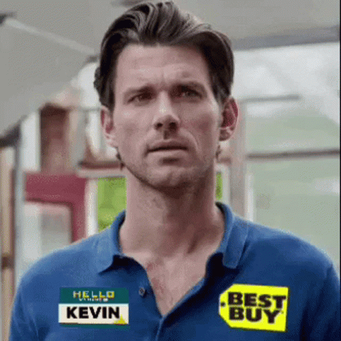 A Man Is Wearing A Blue Shirt With A Best Buy Sticker On It GIF