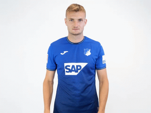 A Man Is Wearing A Blue Shirt With The Word Sap On It GIF