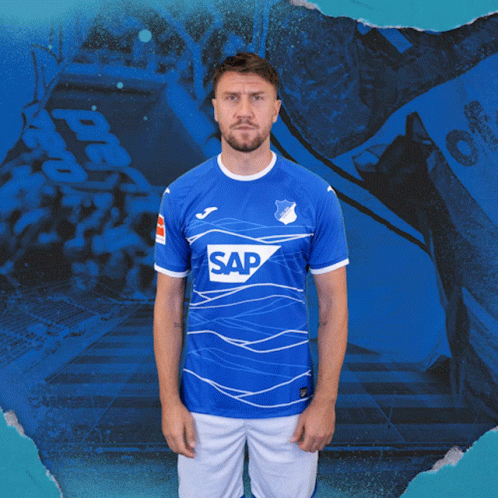 A Man Is Wearing A Blue Shirt With The Word Sap On It GIF