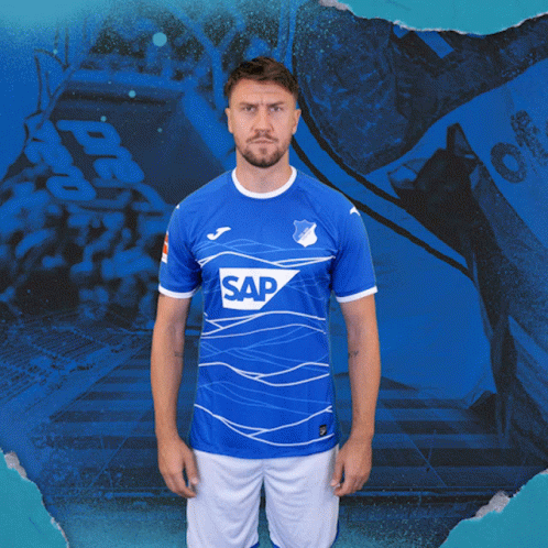 A Man Is Wearing A Blue Shirt With The Word Sap On It GIF